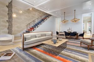 As you ascend the staircase from the first to the second floor, the polychrome runner on the stairs speaks to the palate of the next floor.