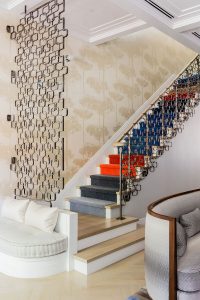 The sweeping custom staircase by La Forge Française is a work of art.